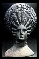 photo of statue with elaborate hairstyle