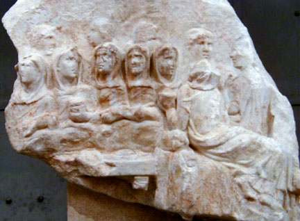 stone carving of six vestal virgins